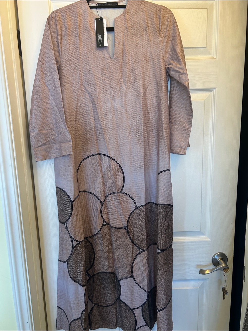 Zanzea Beige Maxi Dress with Black Circle Print and side in-seam hidden pockets.
